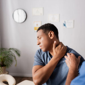 Man receiving somatic therapy for chronic pain relief and emotional healing