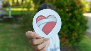Bandaged heart symbol representing emotional healing, trauma release and somatic healing for heart pain – Abi Beri holistic therapist Ireland